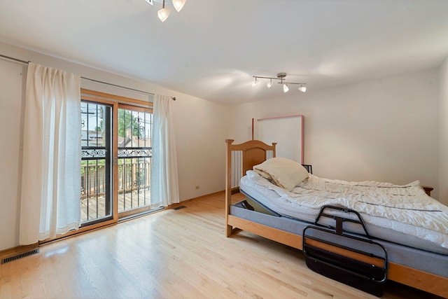 6856 W Montrose Ave, Harwood Heights, IL 60706 - bedroom featuring access to exterior and wood finished floors