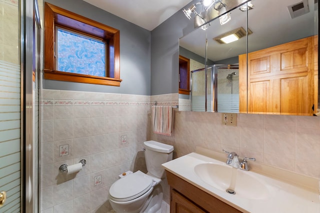 6856 W Montrose Ave, Harwood Heights, IL 60706 - bathroom with tile walls, a shower stall, and vanity