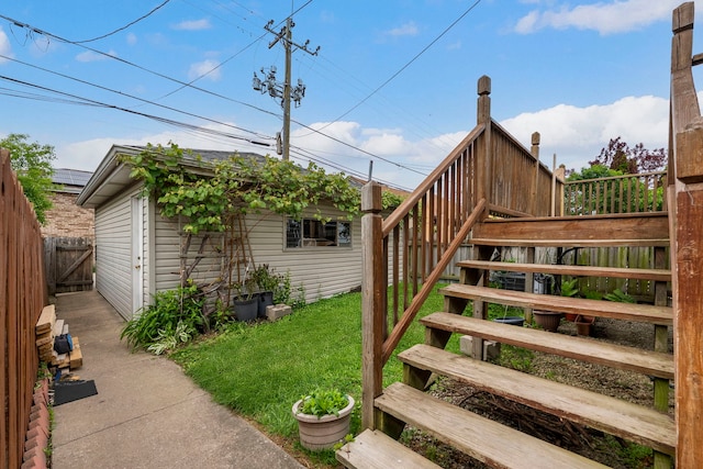 6856 W Montrose Ave, Harwood Heights, IL 60706 - view of yard featuring stairway and an outbuilding