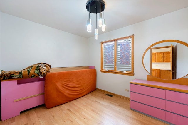 6856 W Montrose Ave, Harwood Heights, IL 60706 - bedroom with light wood finished floors and baseboards