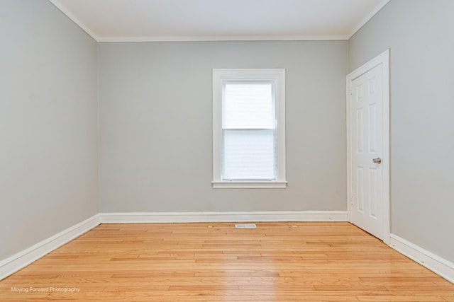 12155 S Normal Ave, Chicago, IL 60628 - empty room with ornamental molding, wood finished floors, and baseboards