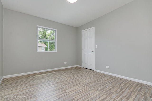12155 S Normal Ave, Chicago, IL 60628 - unfurnished room featuring light wood-style flooring and baseboards