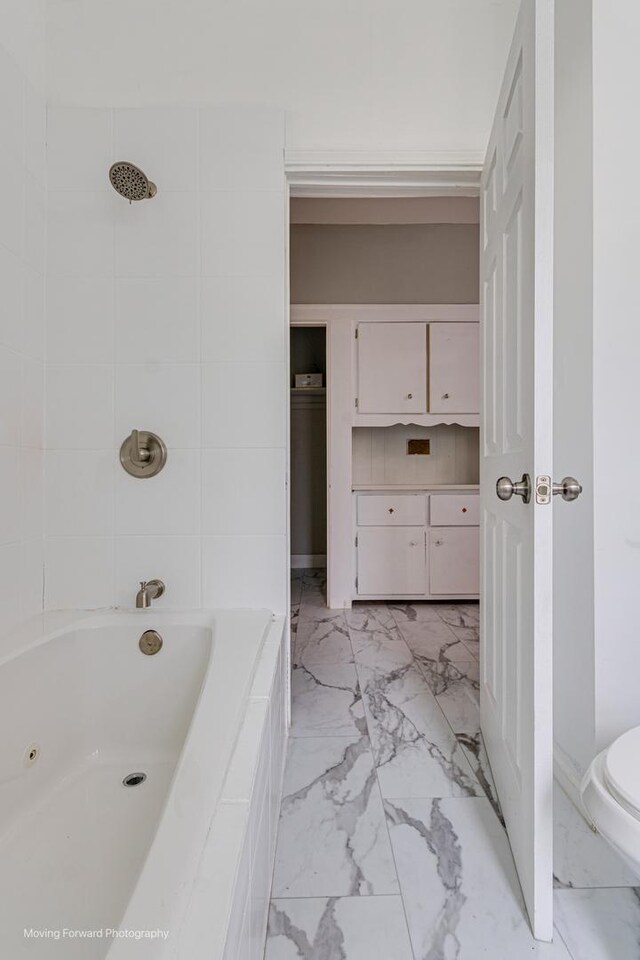 12155 S Normal Ave, Chicago, IL 60628 - bathroom with marble look tiles and toilet