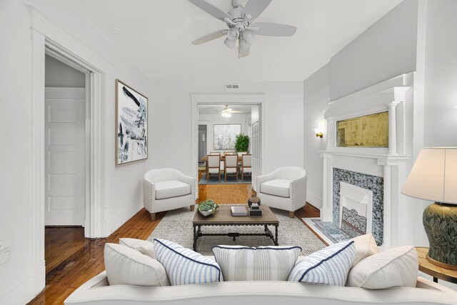 9035 S Burley Ave, Chicago, IL 60617 - living room featuring ceiling fan, hardwood / wood-style floors, and a fireplace