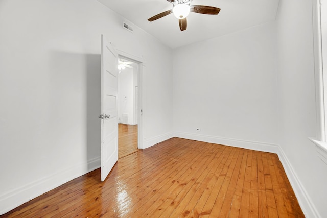 9035 S Burley Ave, Chicago, IL 60617 - spare room featuring a ceiling fan and light wood-style flooring