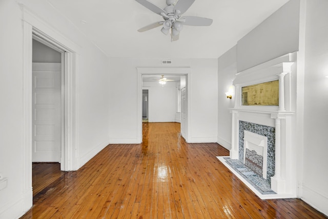 9035 S Burley Ave, Chicago, IL 60617 - unfurnished living room featuring a ceiling fan, hardwood / wood-style flooring, and a fireplace