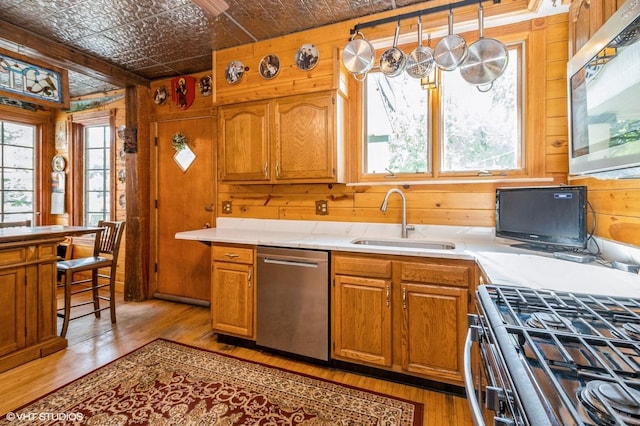 10716 S Hoyne Ave, Chicago, IL 60643 - kitchen with appliances with stainless steel finishes, an ornate ceiling, light wood finished floors, wooden walls, and a sink