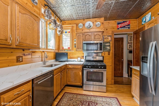 10716 S Hoyne Ave, Chicago, IL 60643 - kitchen with appliances with stainless steel finishes, an ornate ceiling, wooden walls, a sink, and light wood-style floors