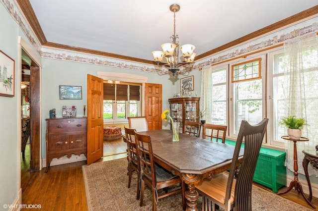 10716 S Hoyne Ave, Chicago, IL 60643 - dining area featuring a chandelier, wood finished floors, and crown molding