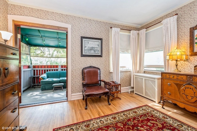 10716 S Hoyne Ave, Chicago, IL 60643 - living area featuring wallpapered walls, wood finished floors, plenty of natural light, crown molding, and radiator