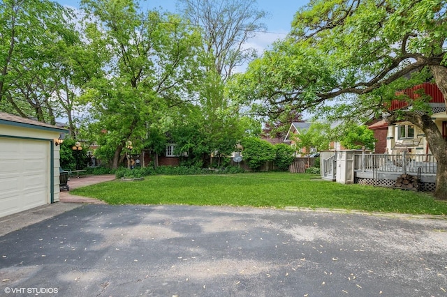 10716 S Hoyne Ave, Chicago, IL 60643 - view of grassy yard featuring a garage and asphalt driveway