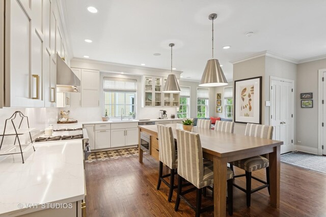 1224 Hinman Ave, Evanston, IL 60202 - dining room with crown molding, dark wood-style floors, recessed lighting, and baseboards