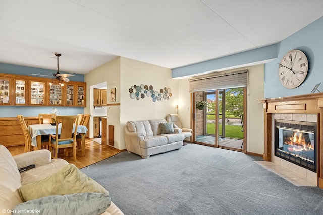 18513 Pine Lake Dr Unit 1, Tinley Park, IL 60477 - carpeted living room with a tiled fireplace, ceiling fan, and baseboards