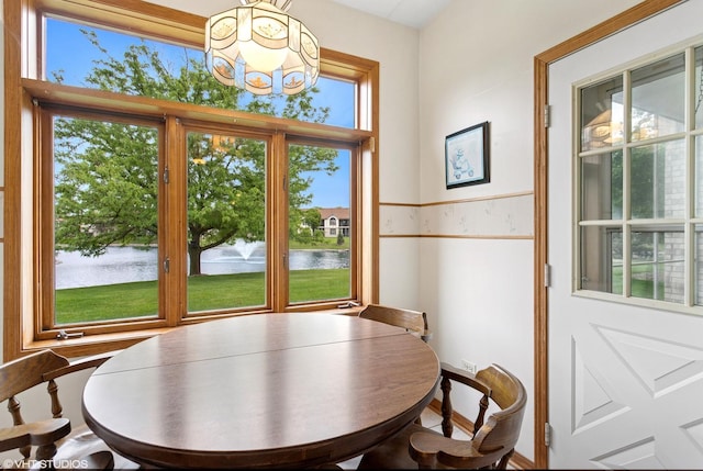 18513 Pine Lake Dr Unit 1, Tinley Park, IL 60477 - dining space with a water view, plenty of natural light, and a chandelier