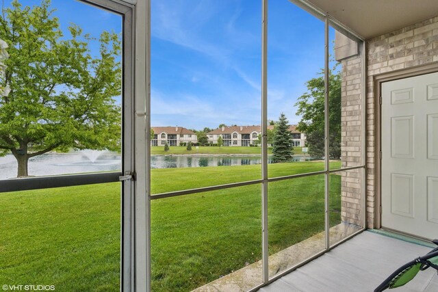 18513 Pine Lake Dr Unit 1, Tinley Park, IL 60477 - unfurnished sunroom featuring a water view and a residential view