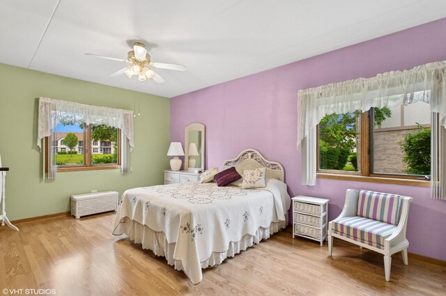 18513 Pine Lake Dr Unit 1, Tinley Park, IL 60477 - bedroom with wood finished floors, baseboards, and ceiling fan