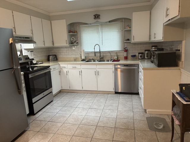kitchen with stainless steel appliances, a sink, open shelves, light countertops, and crown molding