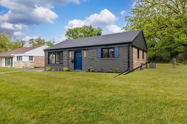 328 Nassau St, Park Forest, IL 60466 - view of front of property with brick siding, a front yard, and a shingled roof