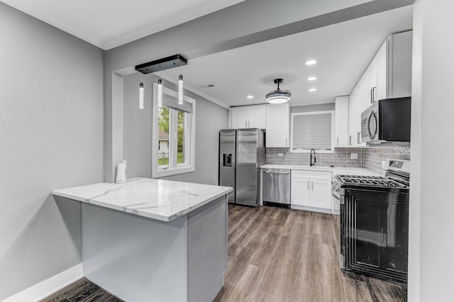 328 Nassau St, Park Forest, IL 60466 - kitchen featuring stainless steel appliances, light stone countertops, ornamental molding, tasteful backsplash, and light wood-style flooring