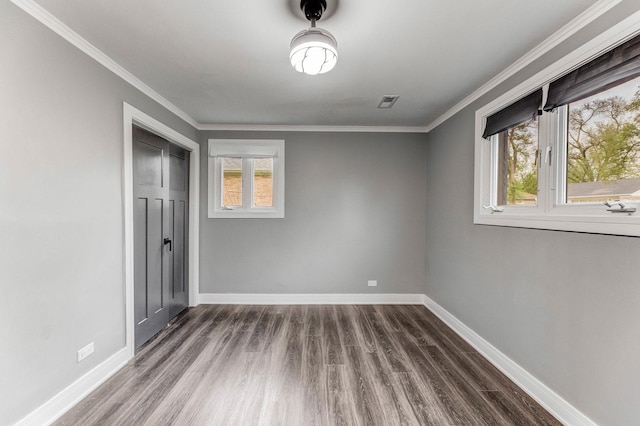 328 Nassau St, Park Forest, IL 60466 - unfurnished bedroom with dark wood-style floors, baseboards, and crown molding