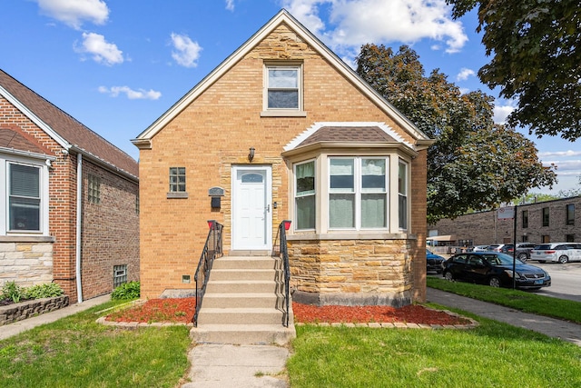 5701 N Mobile Ave, Chicago, IL 60646 - view of front of home featuring brick siding and stone siding