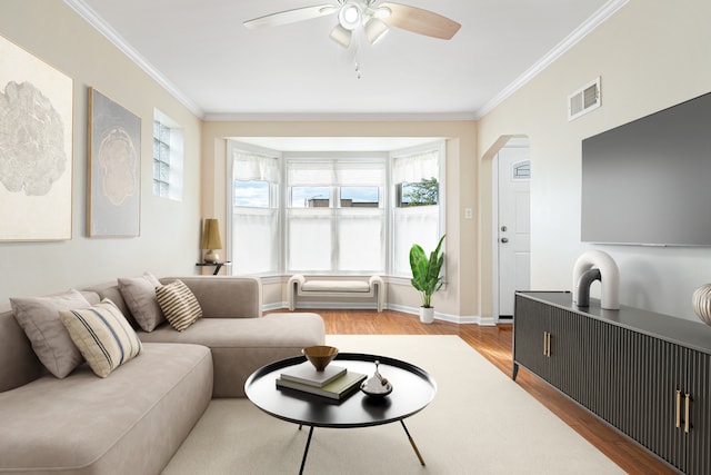 5701 N Mobile Ave, Chicago, IL 60646 - living area with wood finished floors, ornamental molding, a ceiling fan, arched walkways, and baseboards
