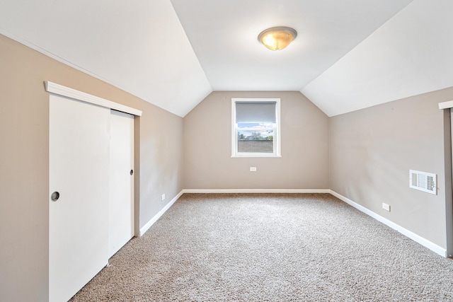 5701 N Mobile Ave, Chicago, IL 60646 - additional living space featuring carpet floors, vaulted ceiling, and baseboards