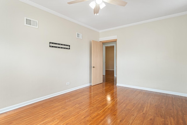 5701 N Mobile Ave, Chicago, IL 60646 - spare room featuring ornamental molding, a ceiling fan, baseboards, and light wood-type flooring