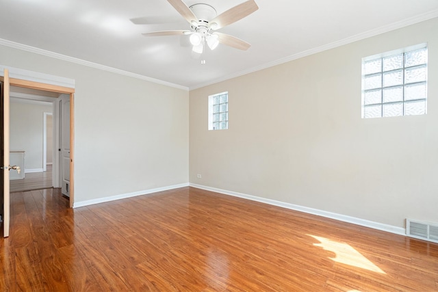 5701 N Mobile Ave, Chicago, IL 60646 - spare room featuring baseboards, ceiling fan, ornamental molding, and wood finished floors