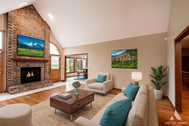 10801 Jillian Rd, Orland Park, IL 60467 - living room featuring high vaulted ceiling, wood finished floors, a fireplace, and baseboards