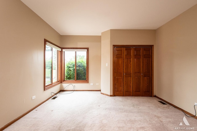 10801 Jillian Rd, Orland Park, IL 60467 - unfurnished bedroom with light colored carpet, baseboards, and a closet