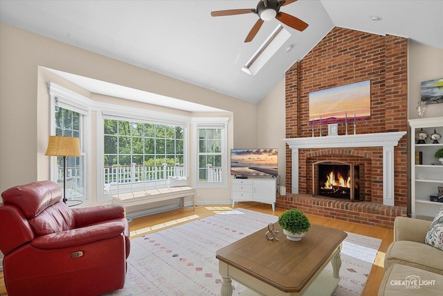 39W835 Carl Sandburg Rd, Saint Charles, IL 60175 - living area featuring a ceiling fan, wood finished floors, a brick fireplace, high vaulted ceiling, and a skylight