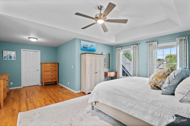 39W835 Carl Sandburg Rd, Saint Charles, IL 60175 - bedroom with baseboards, wood finished floors, a tray ceiling, access to outside, and a ceiling fan