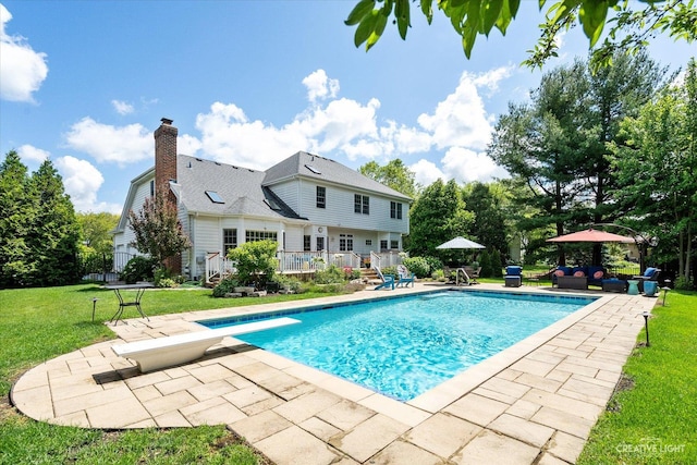 39W835 Carl Sandburg Rd, Saint Charles, IL 60175 - outdoor pool featuring a patio, a yard, a diving board, a wooden deck, and outdoor lounge area