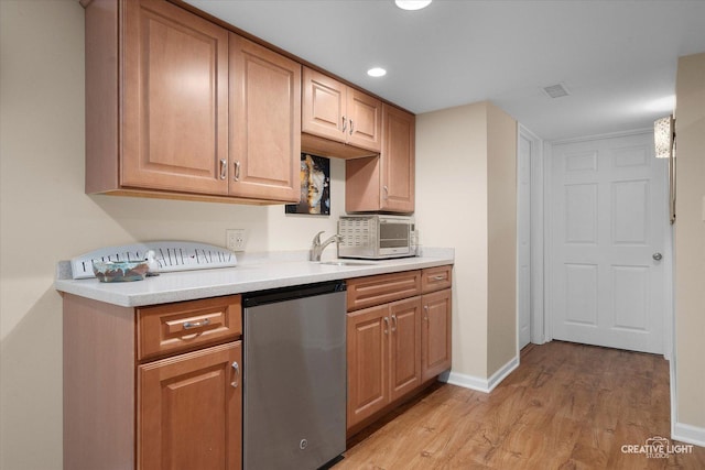39W835 Carl Sandburg Rd, Saint Charles, IL 60175 - kitchen featuring light wood-type flooring, baseboards, dishwasher, light countertops, and a sink