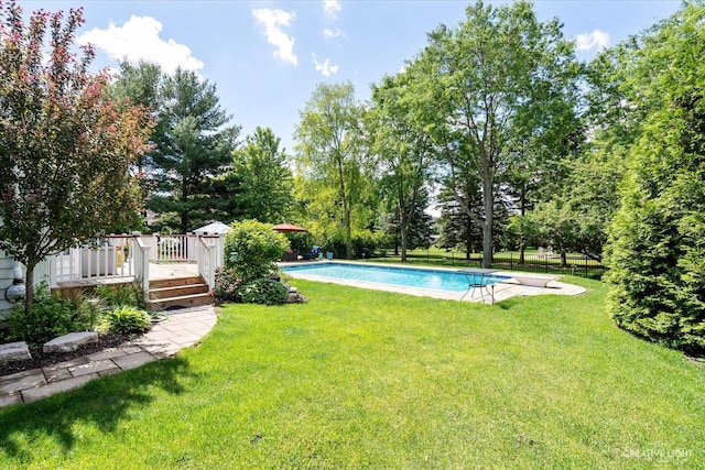 39W835 Carl Sandburg Rd, Saint Charles, IL 60175 - outdoor pool with a wooden deck, a yard, and view of wooded area