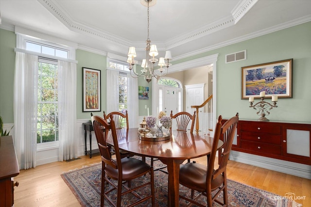 39W835 Carl Sandburg Rd, Saint Charles, IL 60175 - dining space with light wood-style flooring, healthy amount of natural light, a chandelier, crown molding, and a tray ceiling