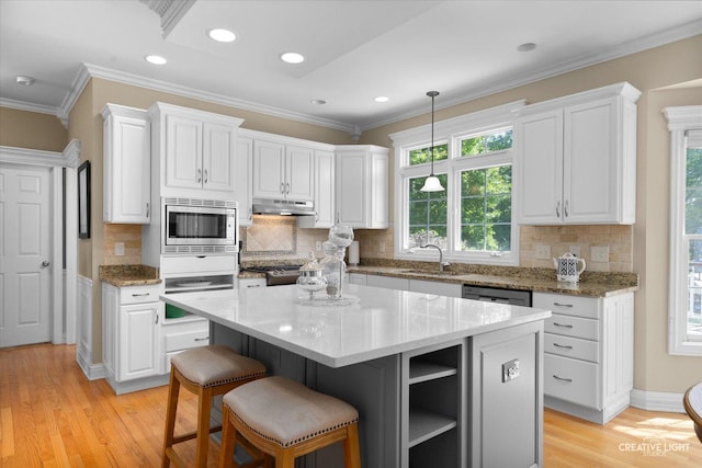 39W835 Carl Sandburg Rd, Saint Charles, IL 60175 - kitchen featuring stainless steel microwave, under cabinet range hood, white cabinets, open shelves, and ornamental molding