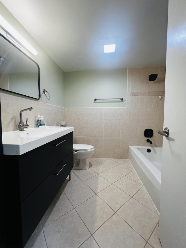 6220 N Ridge Ave Unit S302, Chicago, IL 60660 - bathroom featuring tile walls, tile patterned flooring, vanity, toilet, and tub / shower combination