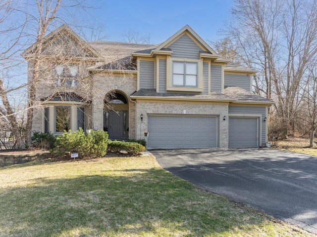 876 Hampstead Ct, Barrington, IL 60010 - view of front of home with driveway, an attached garage, brick siding, a front yard, and a shingled roof