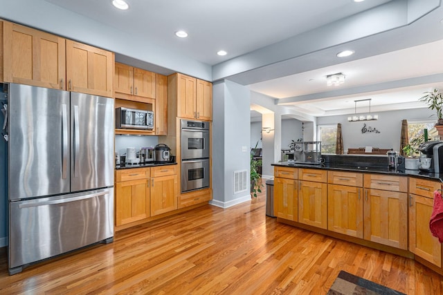 876 Hampstead Ct, Barrington, IL 60010 - kitchen with appliances with stainless steel finishes, light wood-style flooring, recessed lighting, arched walkways, and pendant lighting