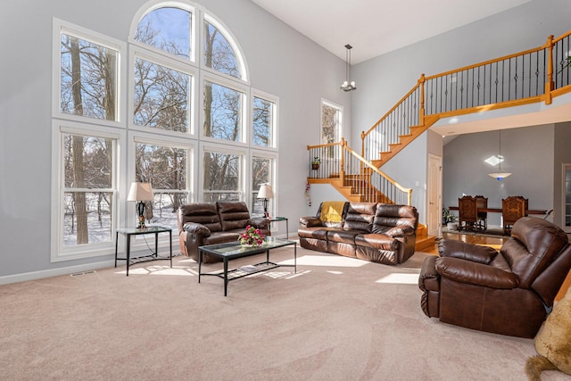 876 Hampstead Ct, Barrington, IL 60010 - carpeted living area featuring a high ceiling, stairway, and baseboards