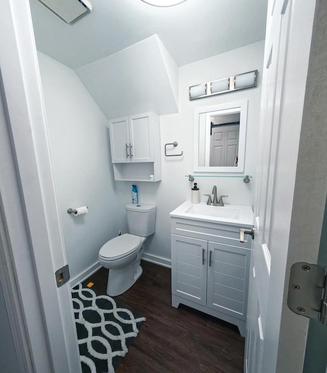 9352 Sunrise Ln Unit B1, Orland Park, IL 60462 - bathroom with toilet, wood finished floors, vanity, and baseboards