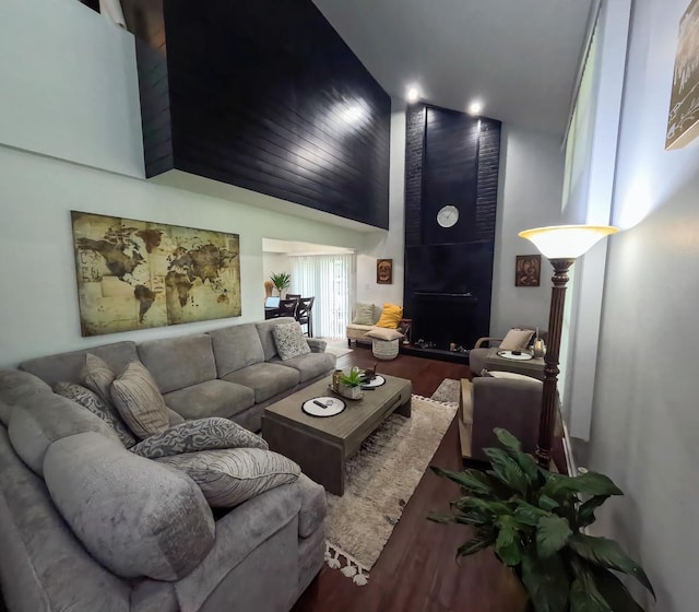 9352 Sunrise Ln Unit B1, Orland Park, IL 60462 - living area with wood finished floors, high vaulted ceiling, and a large fireplace