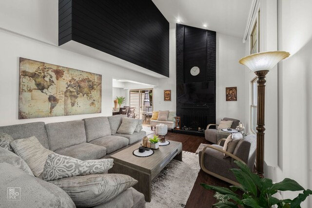 9352 Sunrise Ln Unit B1, Orland Park, IL 60462 - living room with high vaulted ceiling, wood finished floors, a fireplace, and recessed lighting