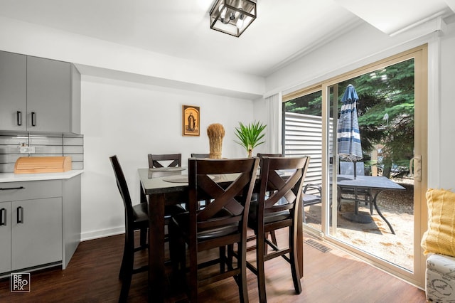 9352 Sunrise Ln Unit B1, Orland Park, IL 60462 - dining area featuring dark wood finished floors and baseboards