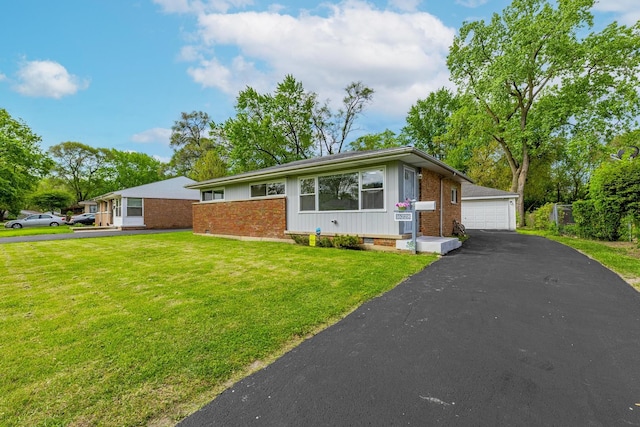 16228 Sussex Ave, Markham, IL 60428 - view of front facade with brick siding, a front yard, and a garage