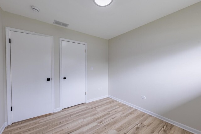 16228 Sussex Ave, Markham, IL 60428 - unfurnished bedroom with light wood finished floors and baseboards