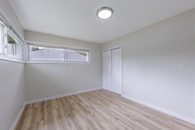 16228 Sussex Ave, Markham, IL 60428 - unfurnished bedroom featuring light wood finished floors, a closet, and baseboards