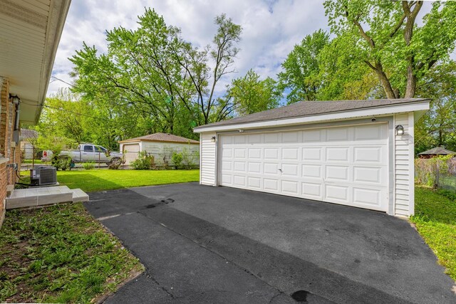 16228 Sussex Ave, Markham, IL 60428 - detached garage featuring central air condition unit